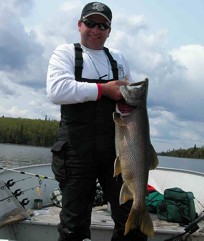 This is a photo of a man holding a fat 18 pound Lake Trout